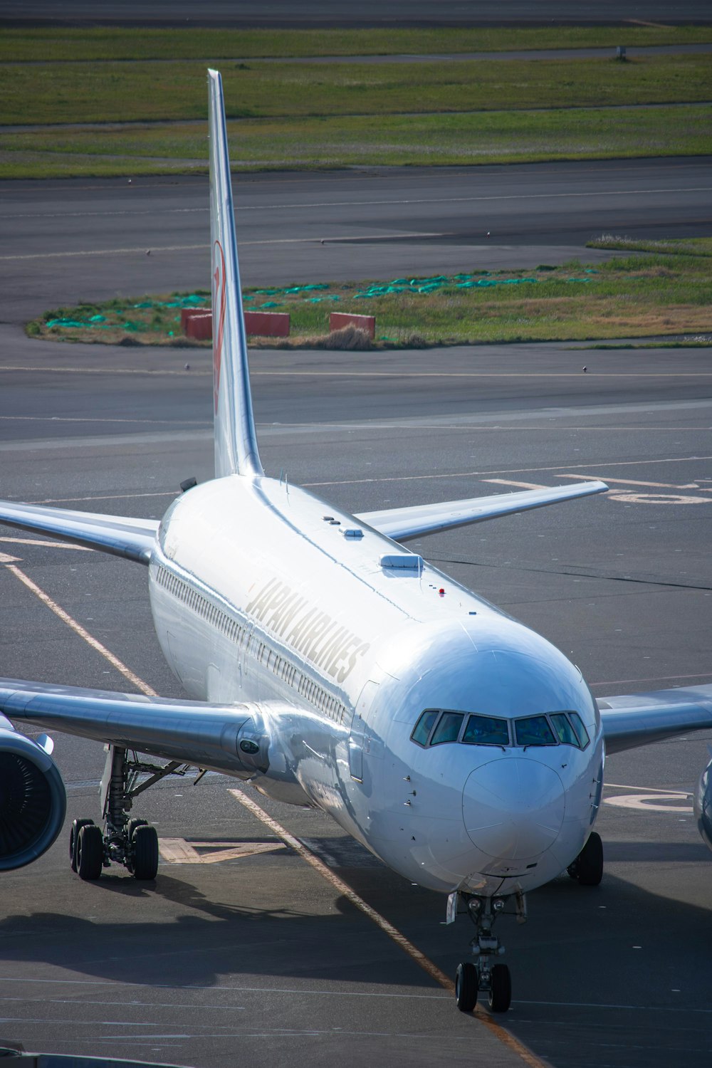 a large jetliner sitting on top of an airport tarmac