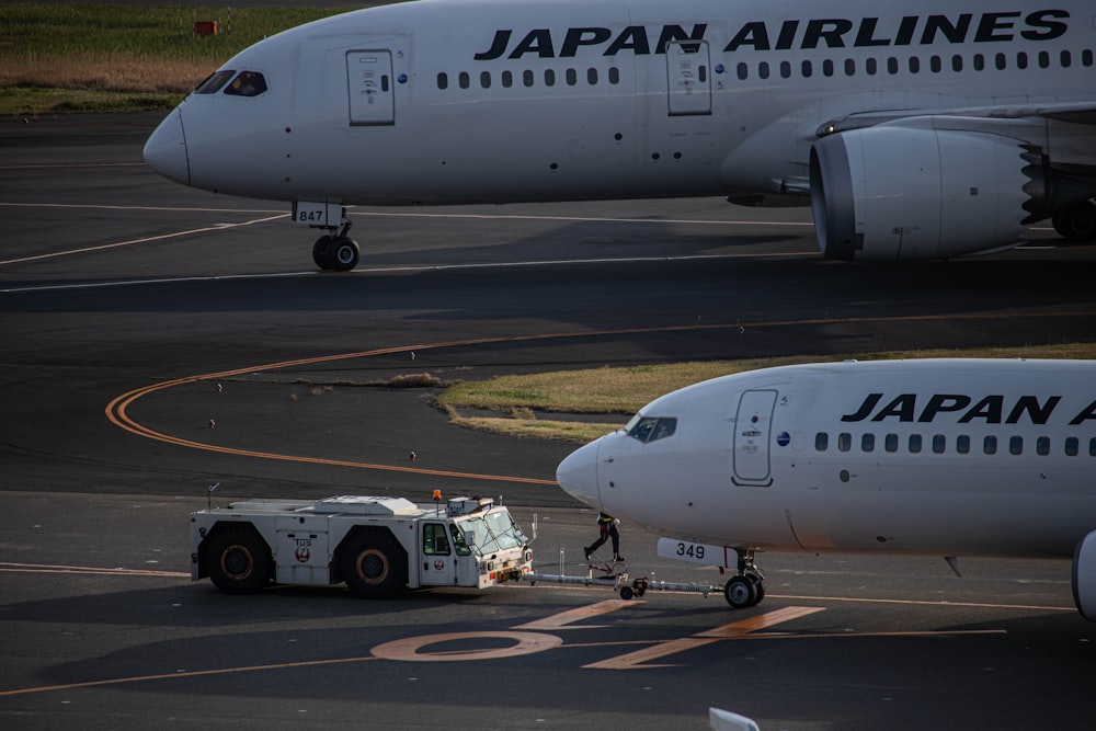 a large jetliner sitting on top of an airport tarmac