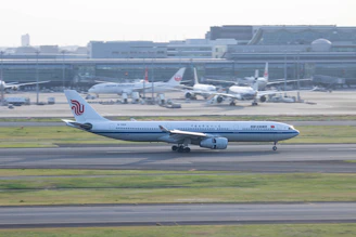 a large jetliner sitting on top of an airport runway