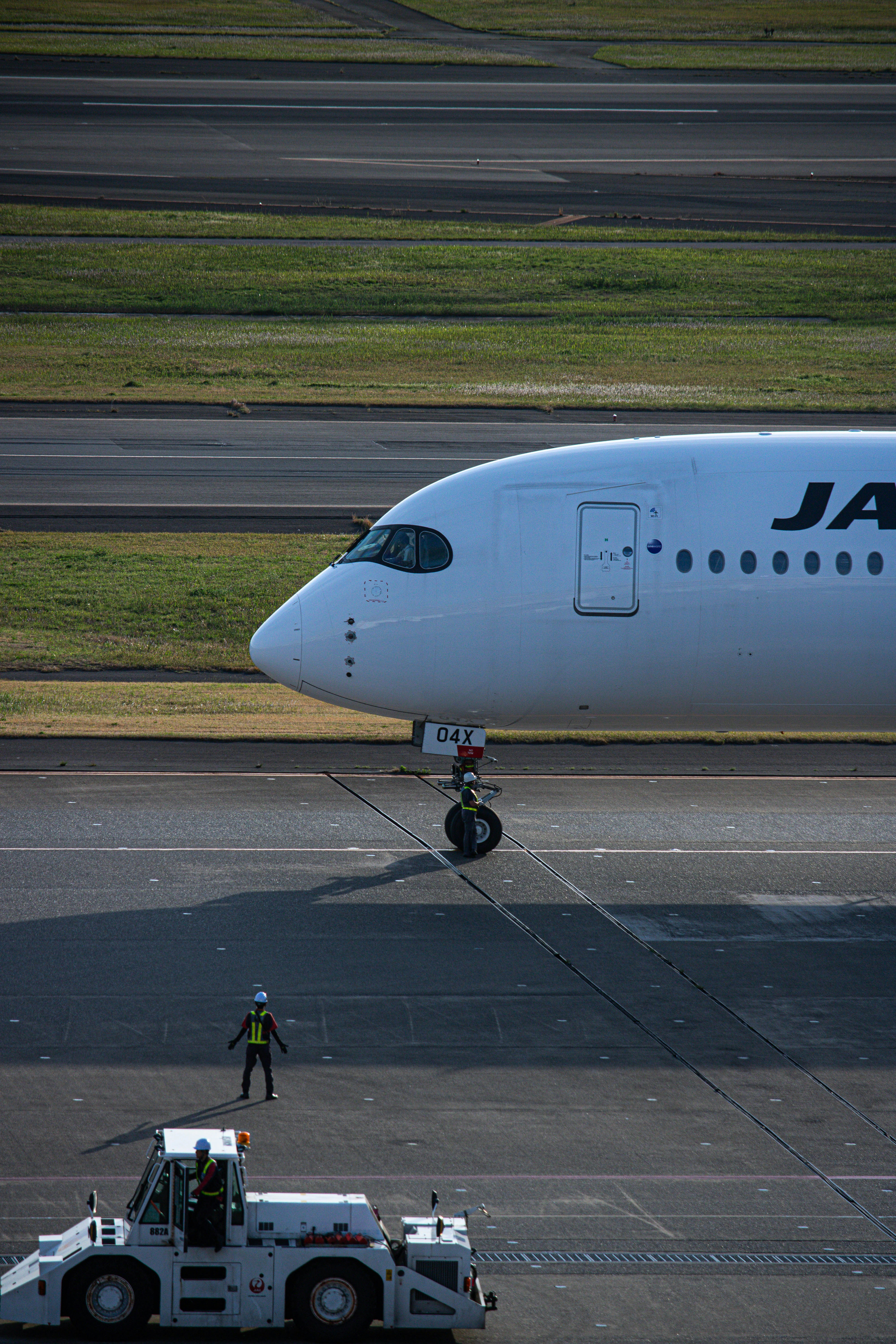 a large jetliner sitting on top of an airport runway