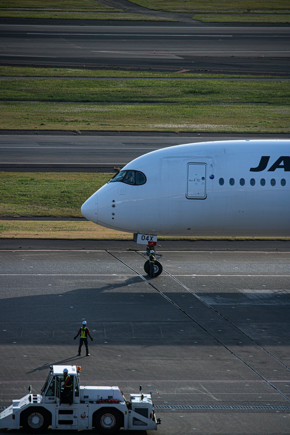 a large jetliner sitting on top of an airport runway