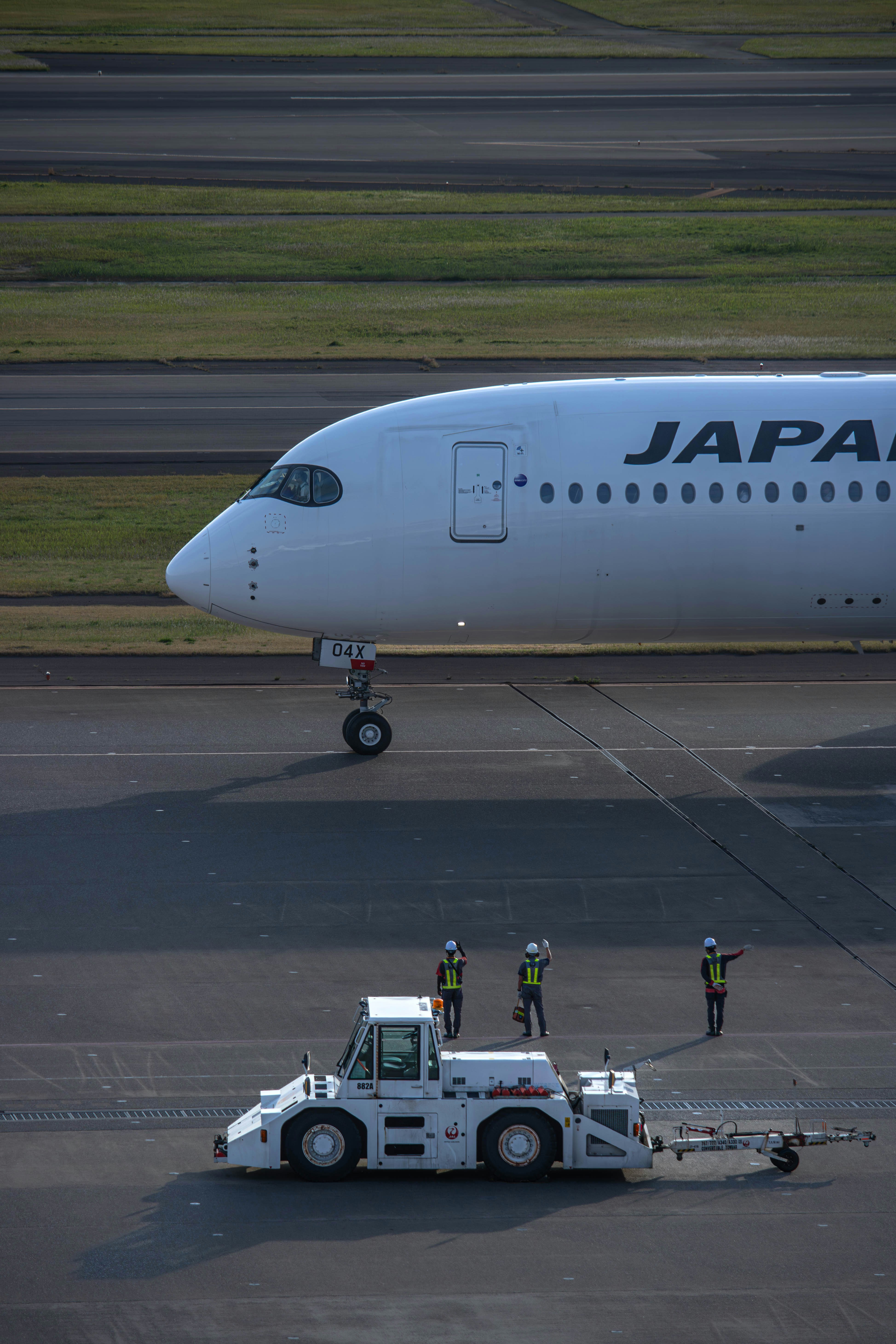 a large jetliner sitting on top of an airport tarmac