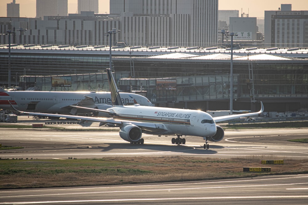 a large jetliner sitting on top of an airport runway