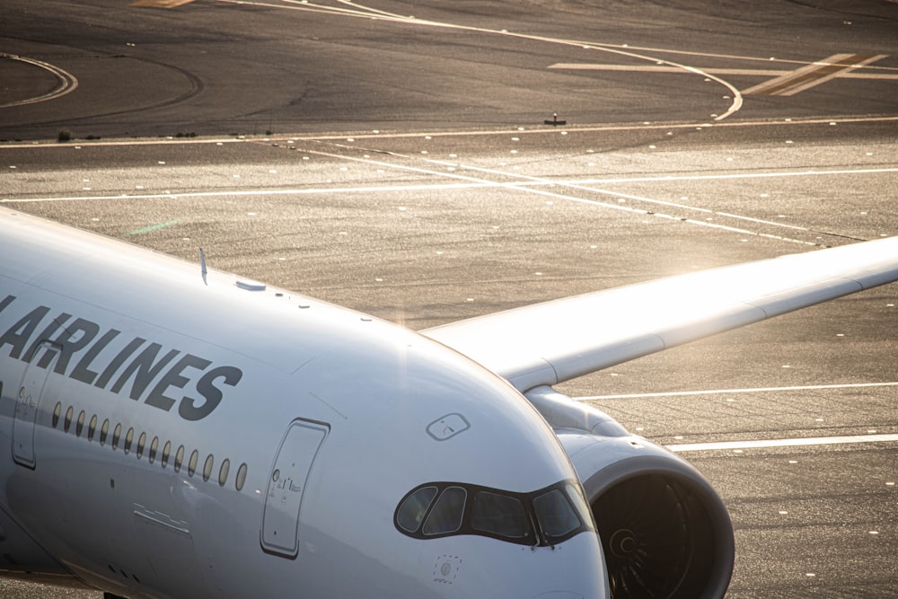 a large jetliner sitting on top of an airport tarmac