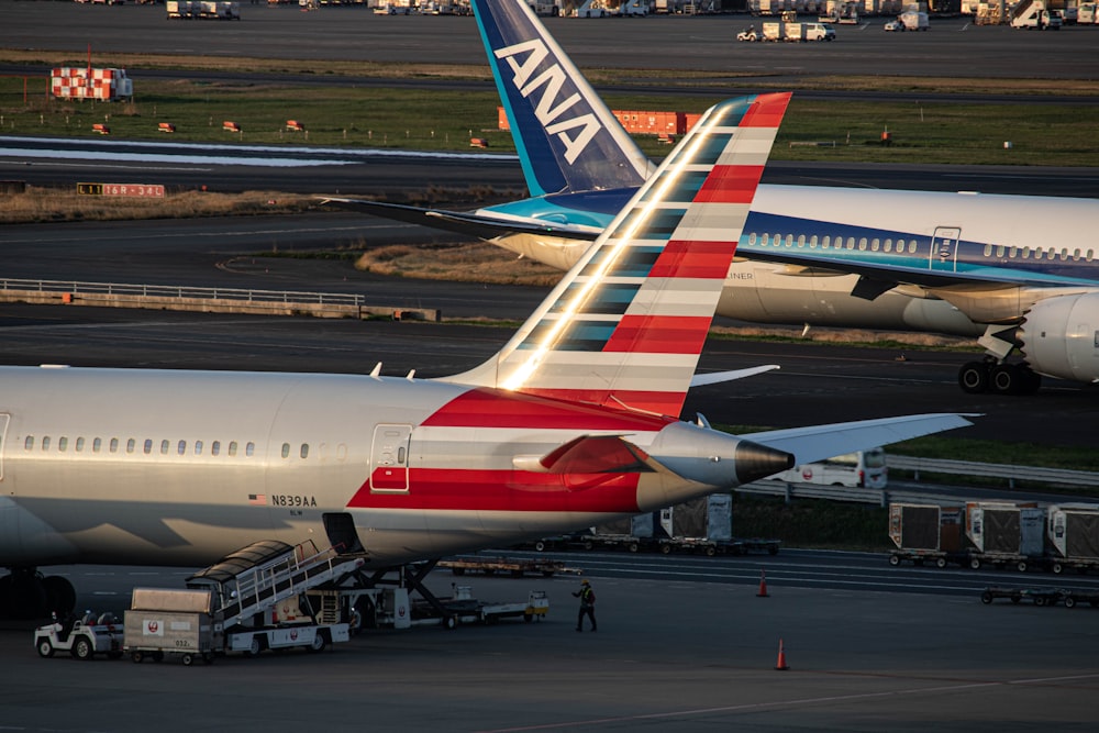 a couple of airplanes that are on a runway