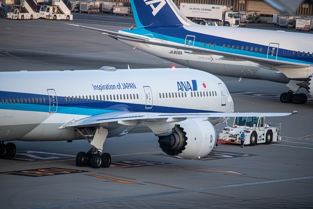 a large jetliner sitting on top of an airport tarmac