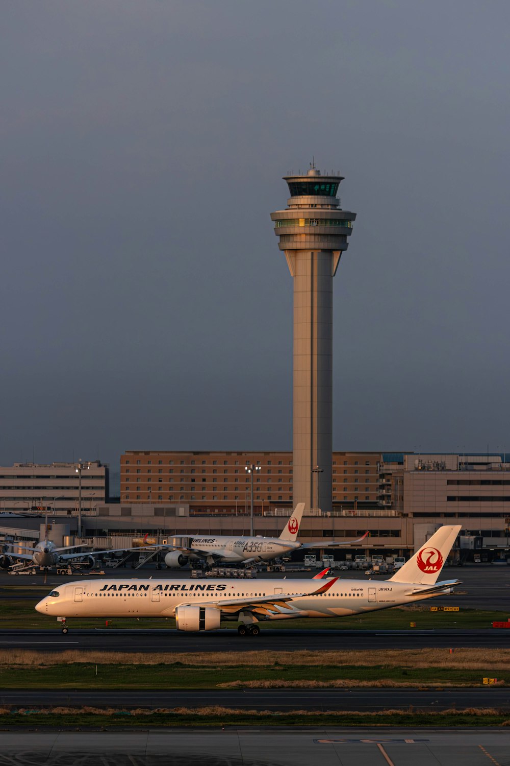 a large jetliner sitting on top of an airport tarmac