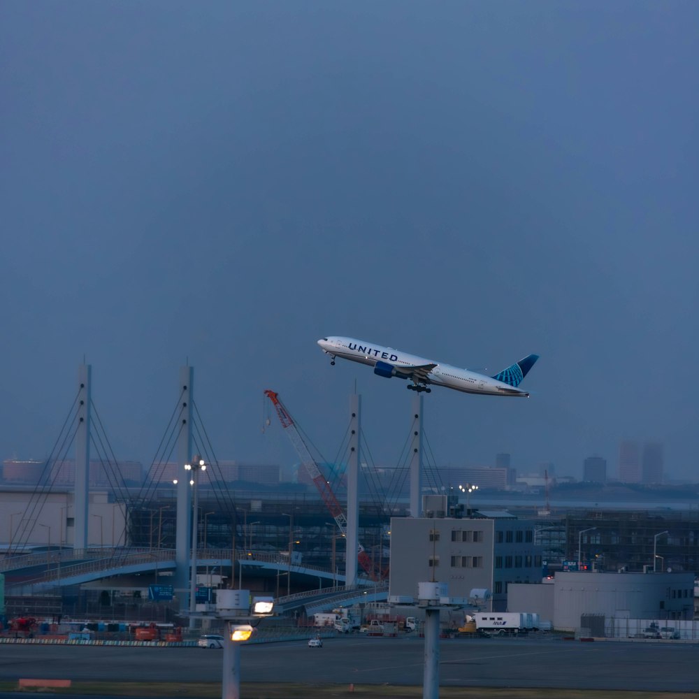 a large jetliner flying through a cloudy sky