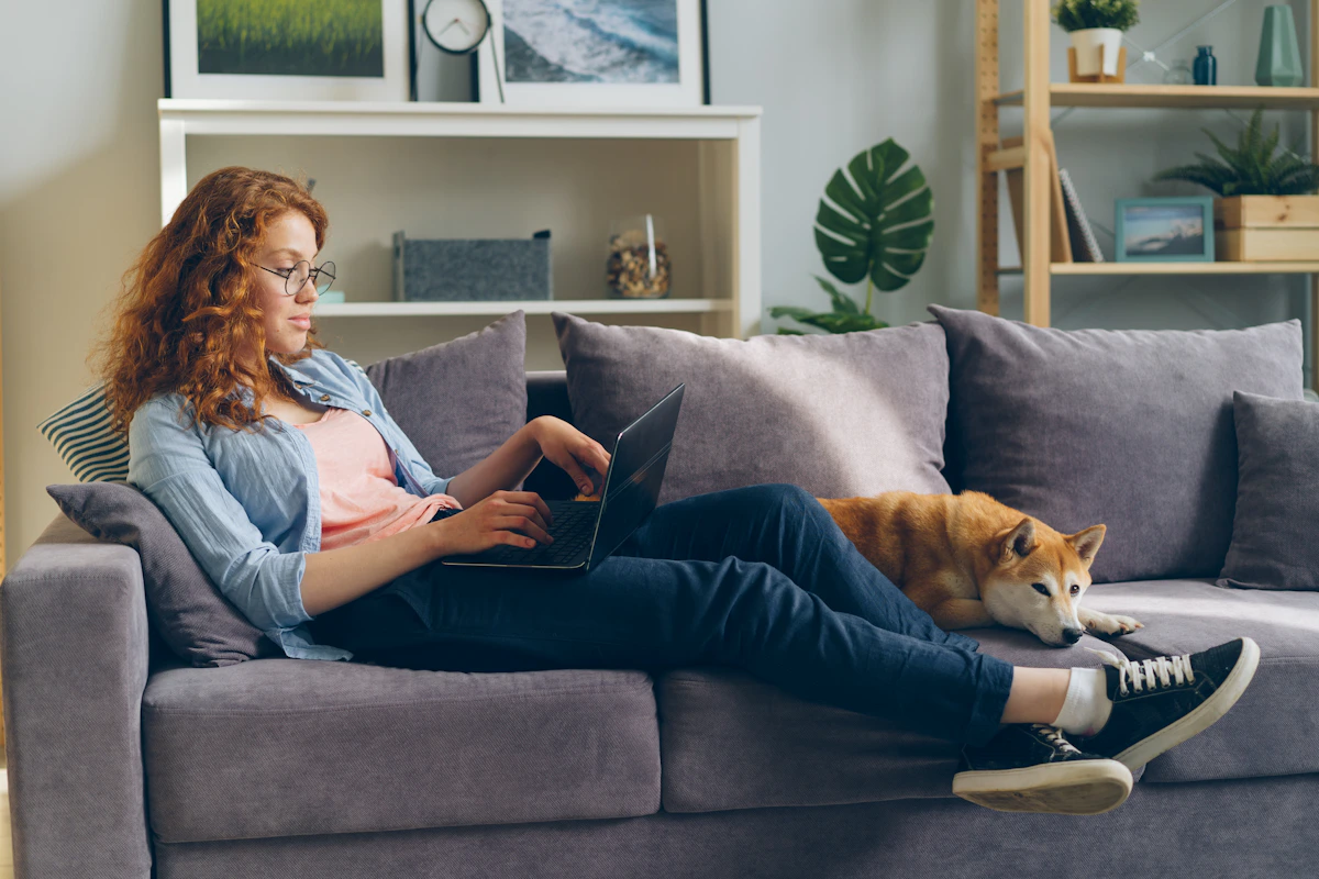Pet parent relaxing at home with her cat