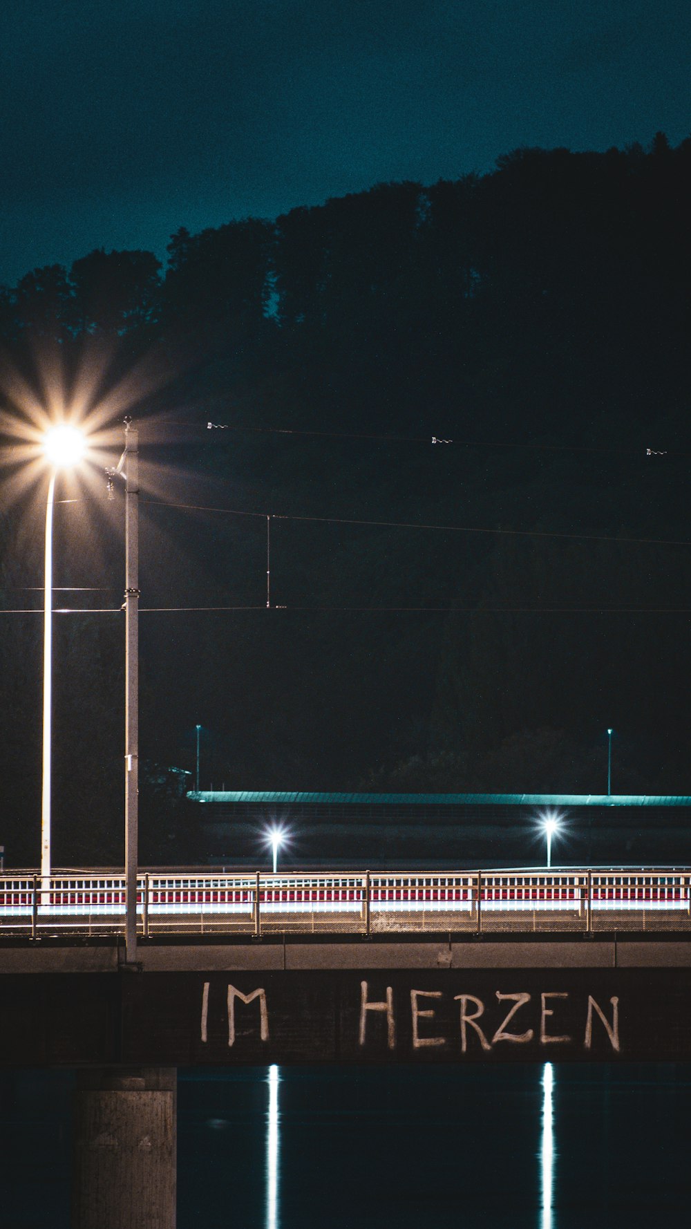 a bridge over a body of water at night