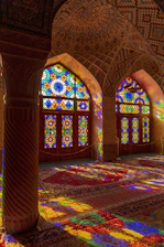 a large room with stained glass windows in it