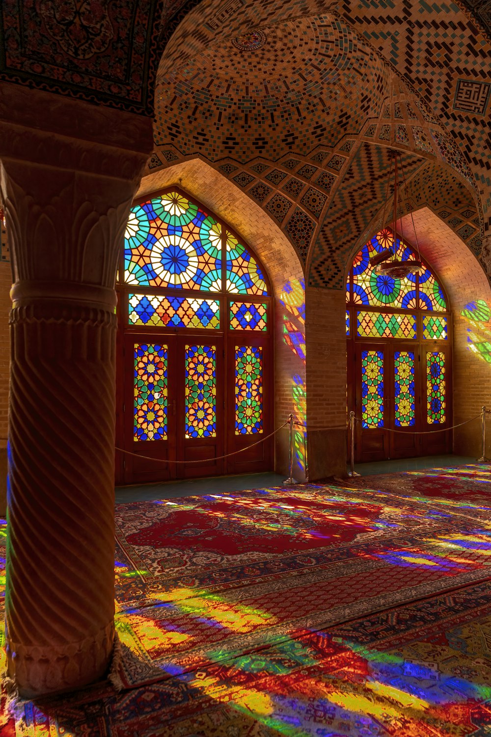 a large room with stained glass windows in it