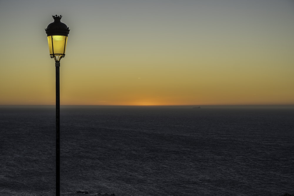 a street light sitting on the side of a cliff
