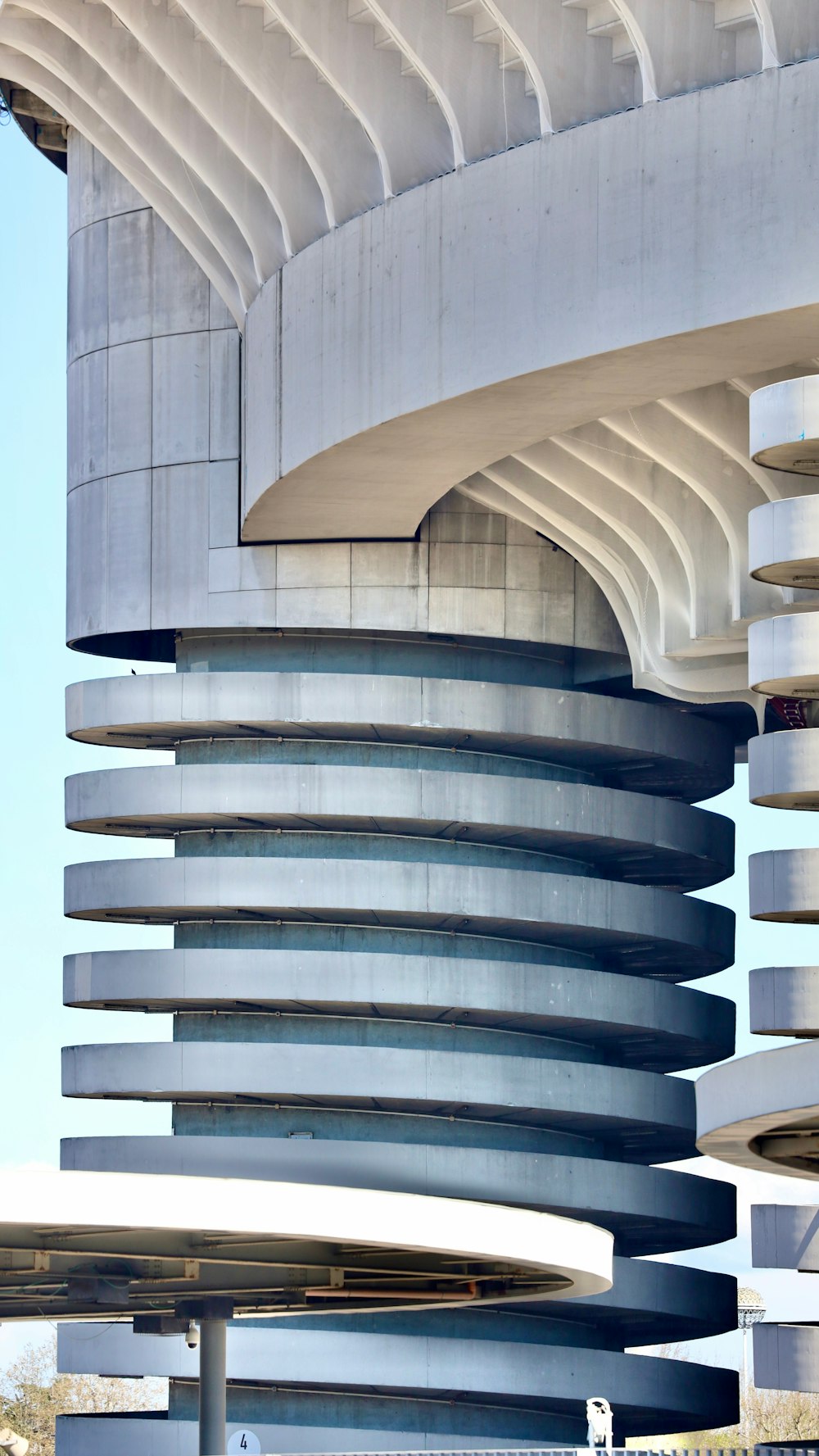 a tall building with a curved design on the side of it