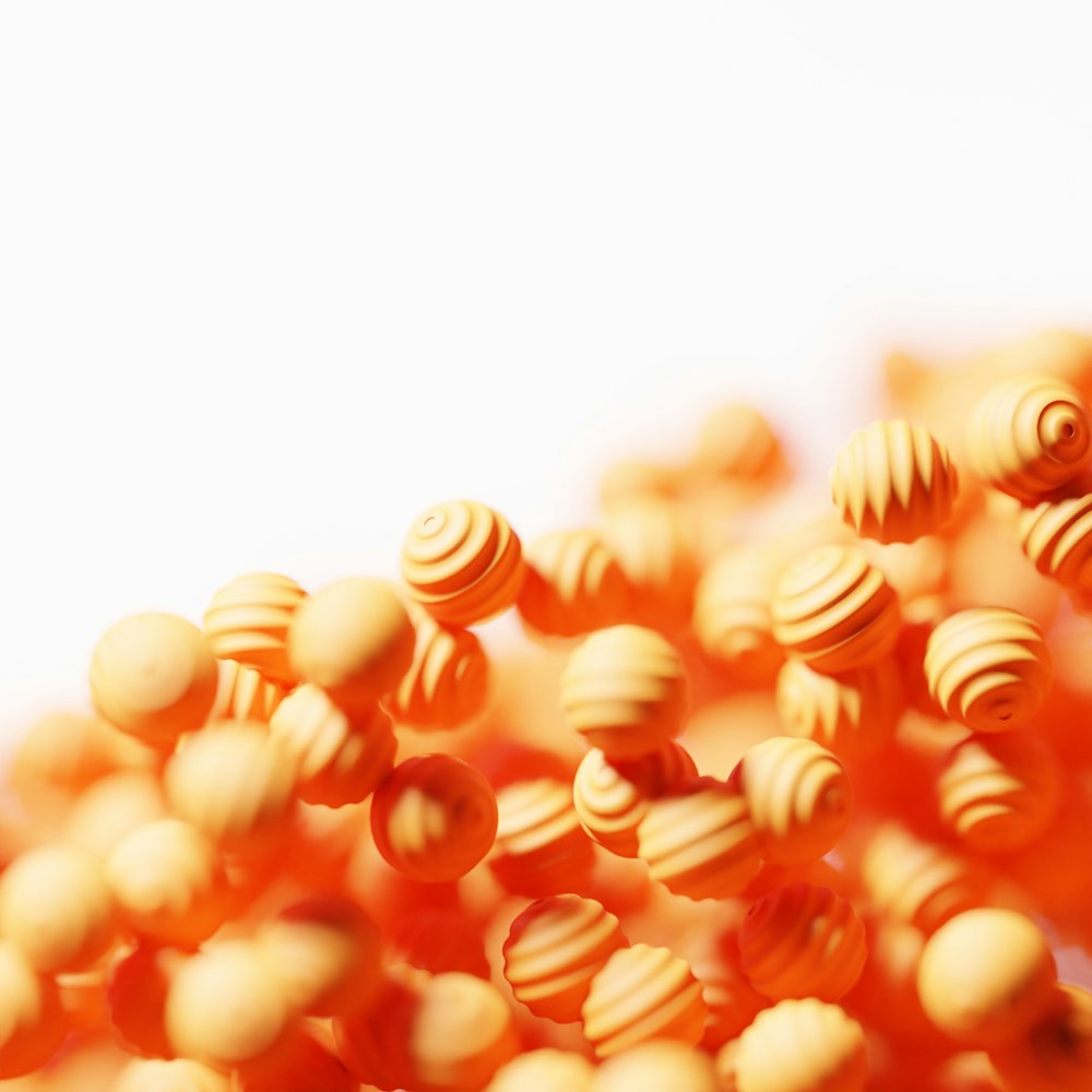 a close up of a bunch of orange beads