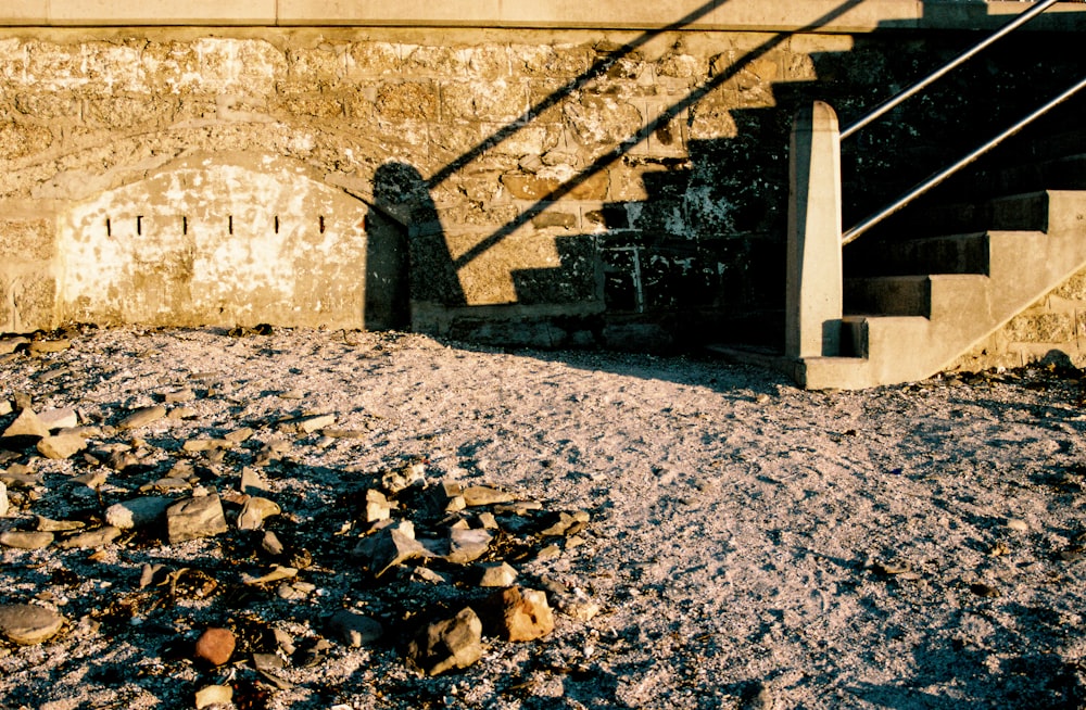 a bunch of rubble on the ground next to a stair case