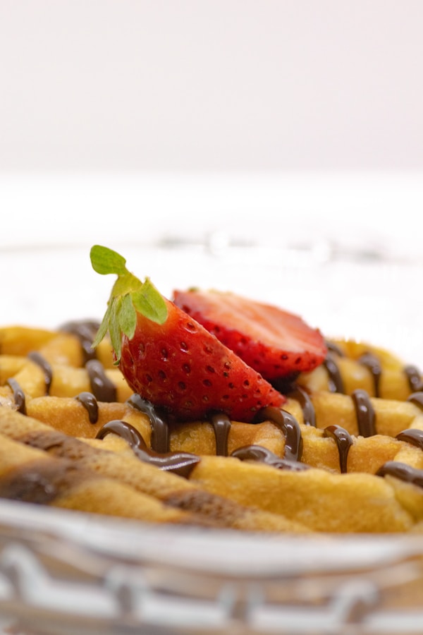 A dessert with chocolate and a strawberry on top