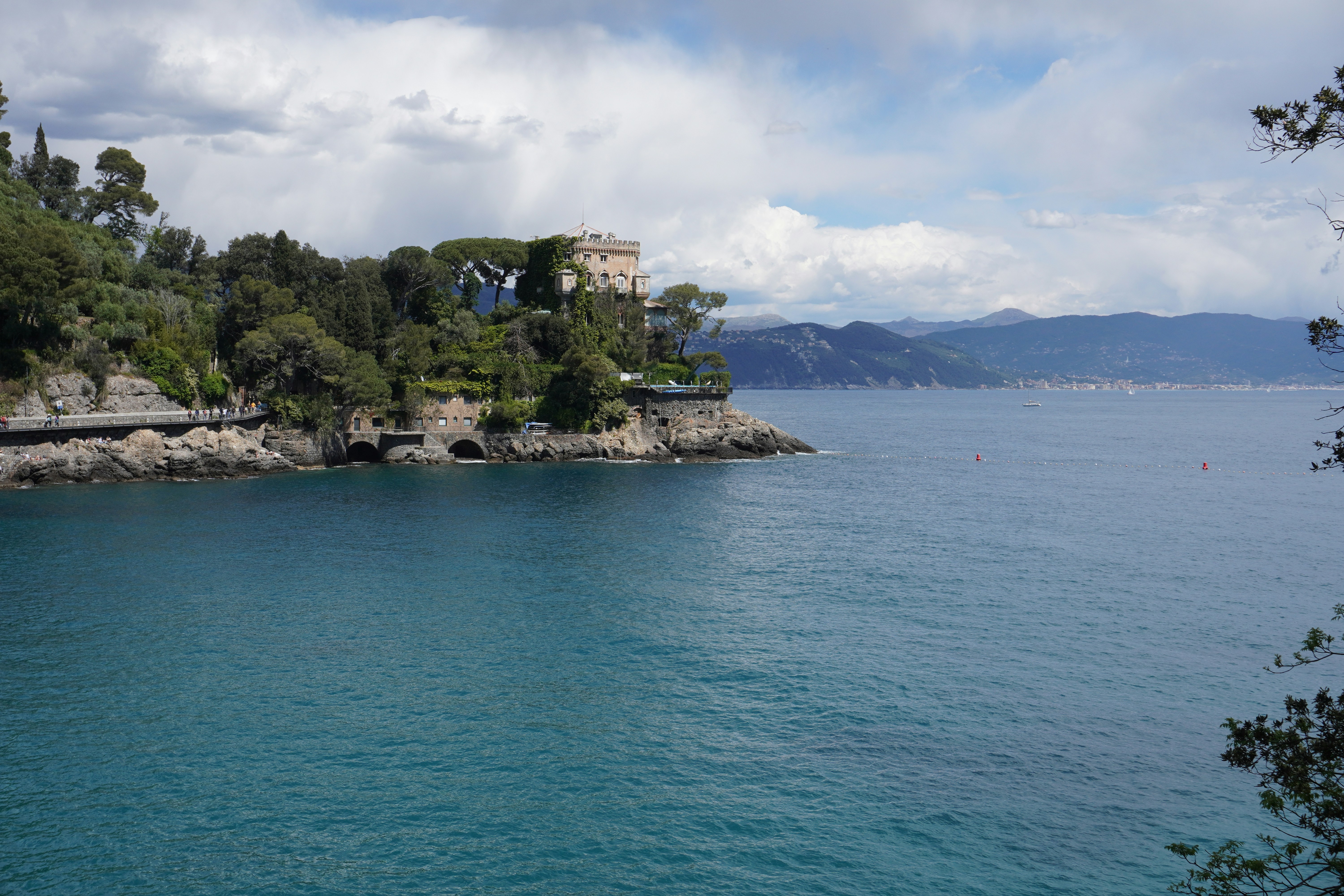 a large body of water surrounded by trees, Panorama view of the seaside city, mountains on the horizon, Portofino