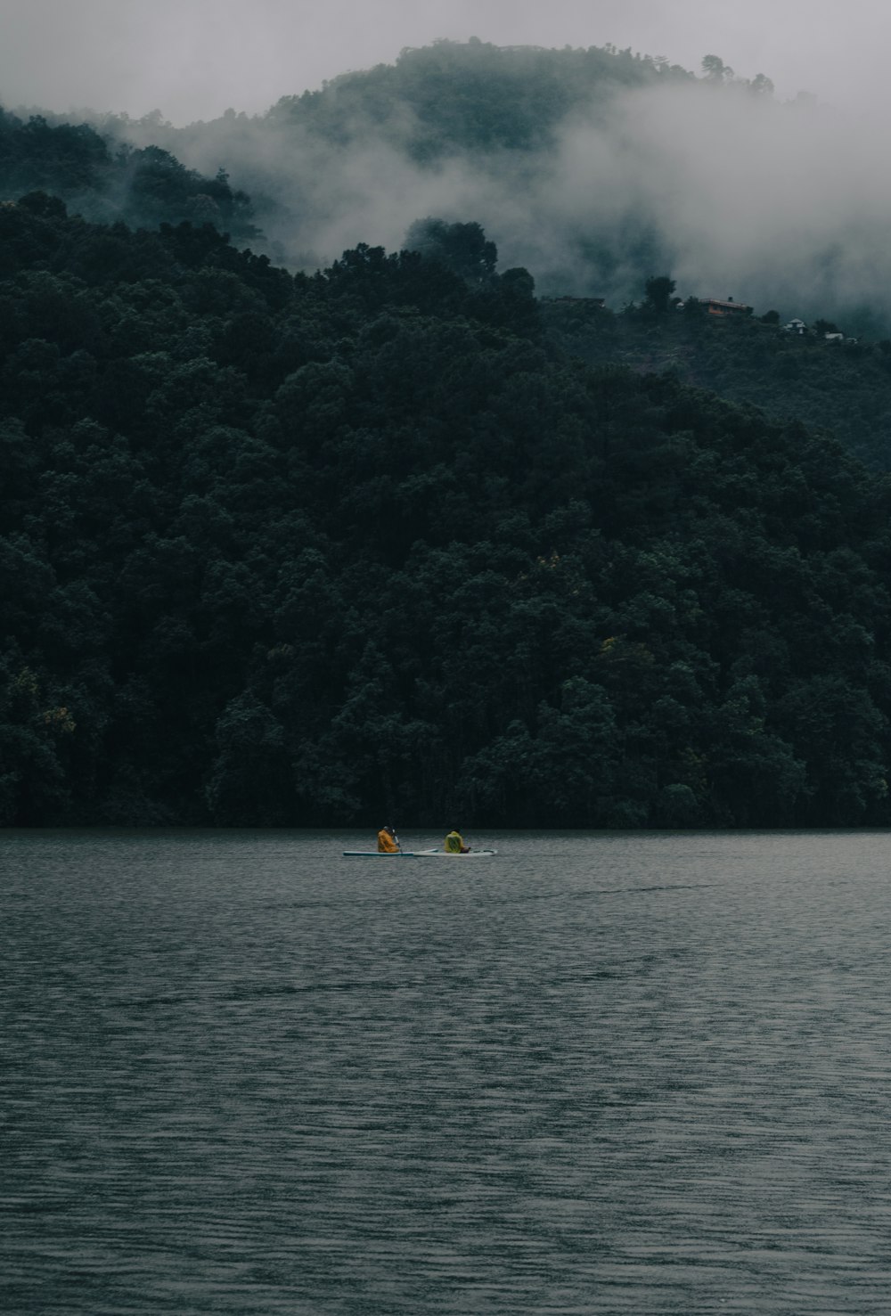 a boat floating on top of a large body of water