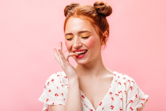 a woman with red hair is making a funny face