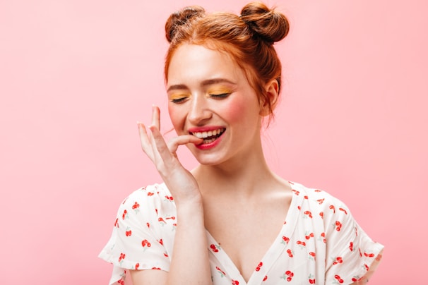 a woman with red hair is making a funny face