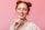 a woman with red hair is smiling and posing for a picture