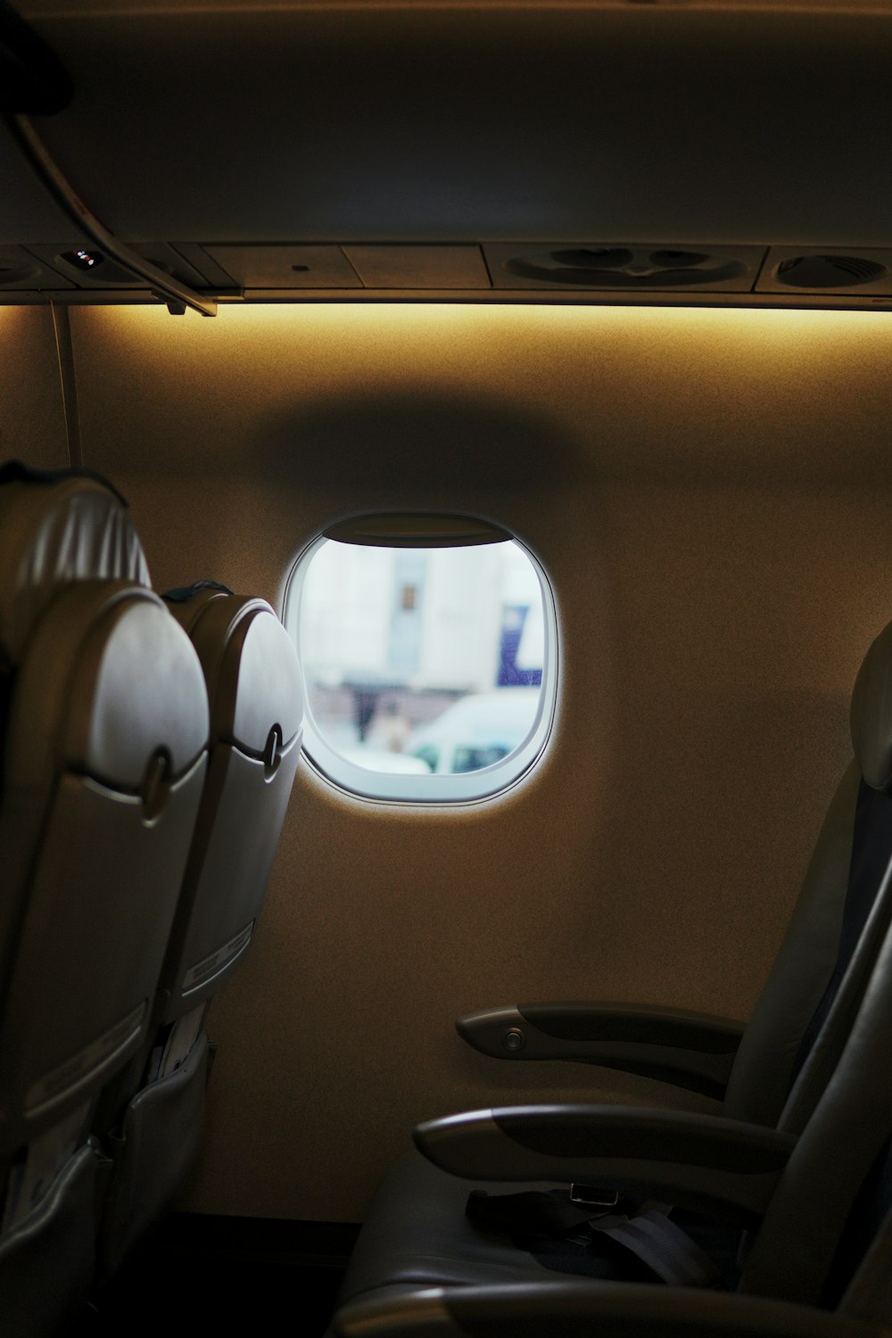 a view of the inside of an airplane looking out the window