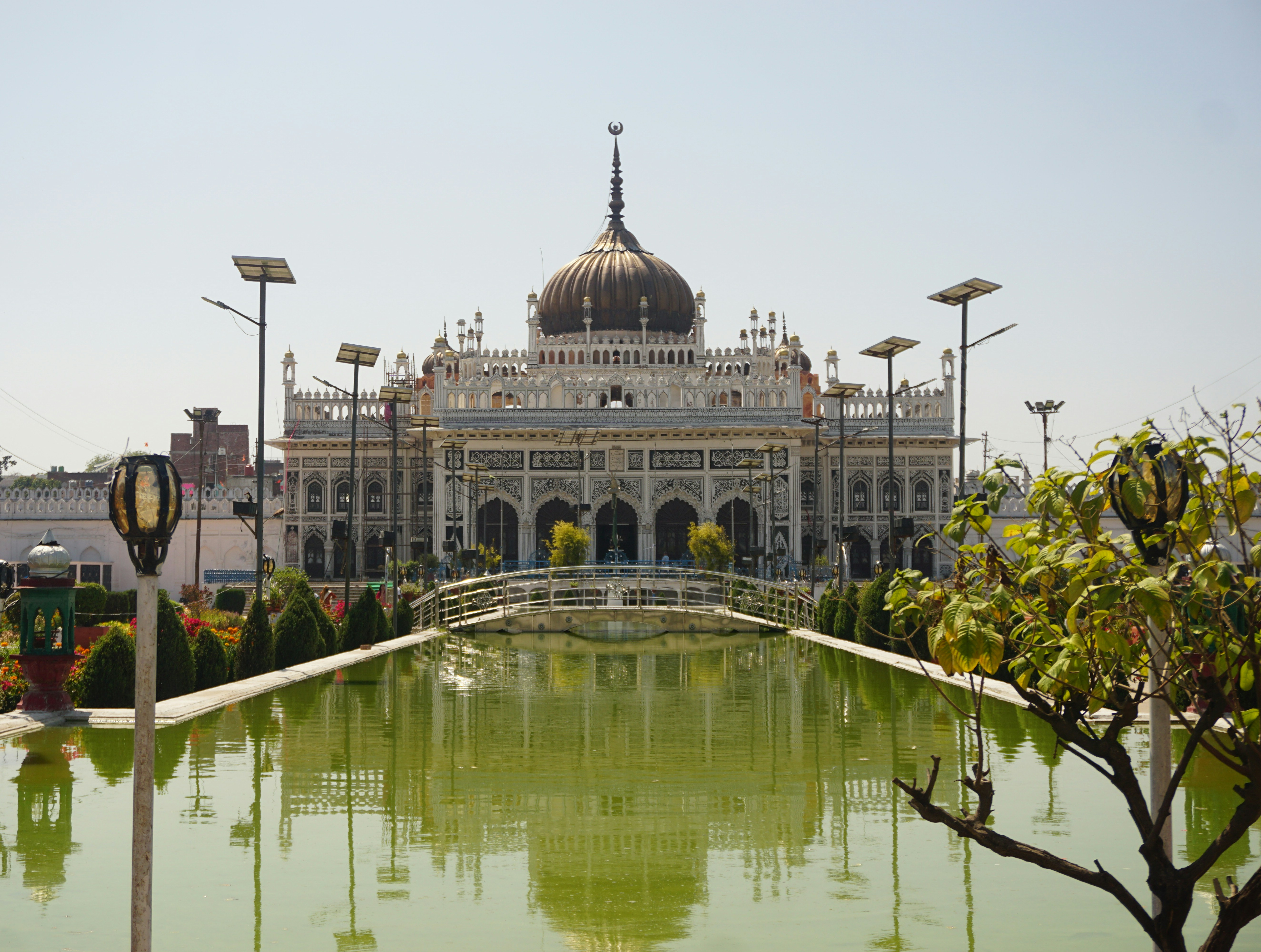 a large building with a large pond in front of it