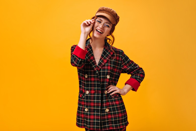 a woman in a red and black plaid coat