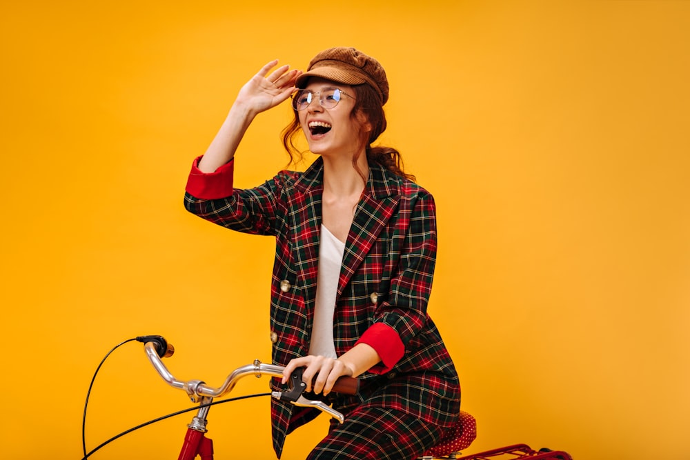 a woman riding a bike with a surprised look on her face