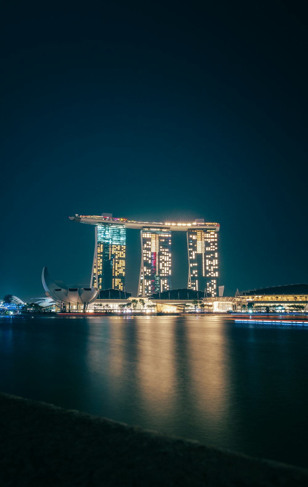 a large body of water with a bunch of buildings in the background