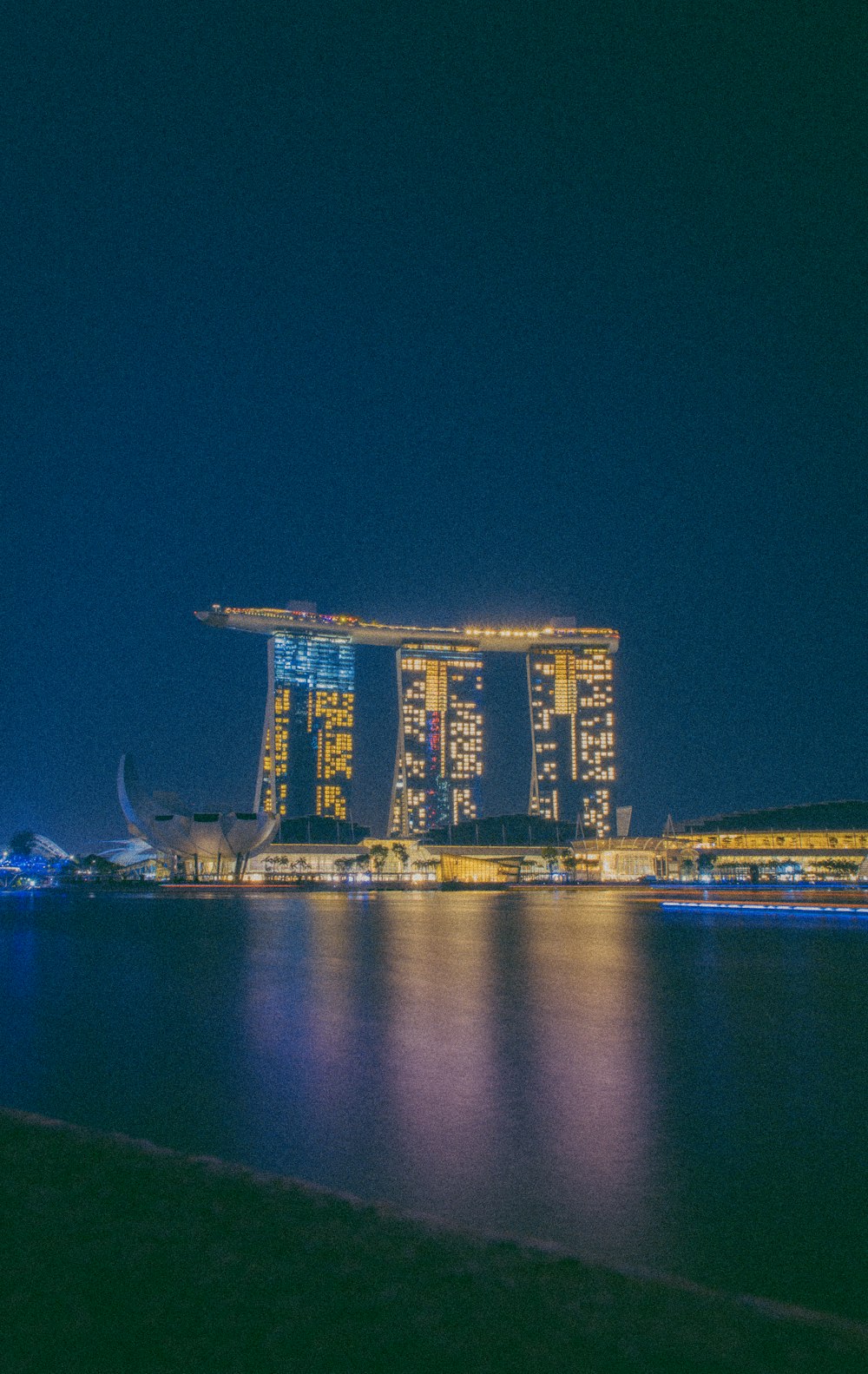 a large body of water with a bunch of buildings in the background