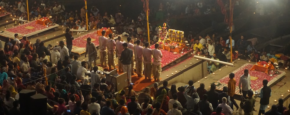 a group of men standing on top of a stage