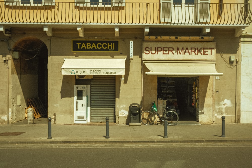 a store front with a bicycle parked in front of it