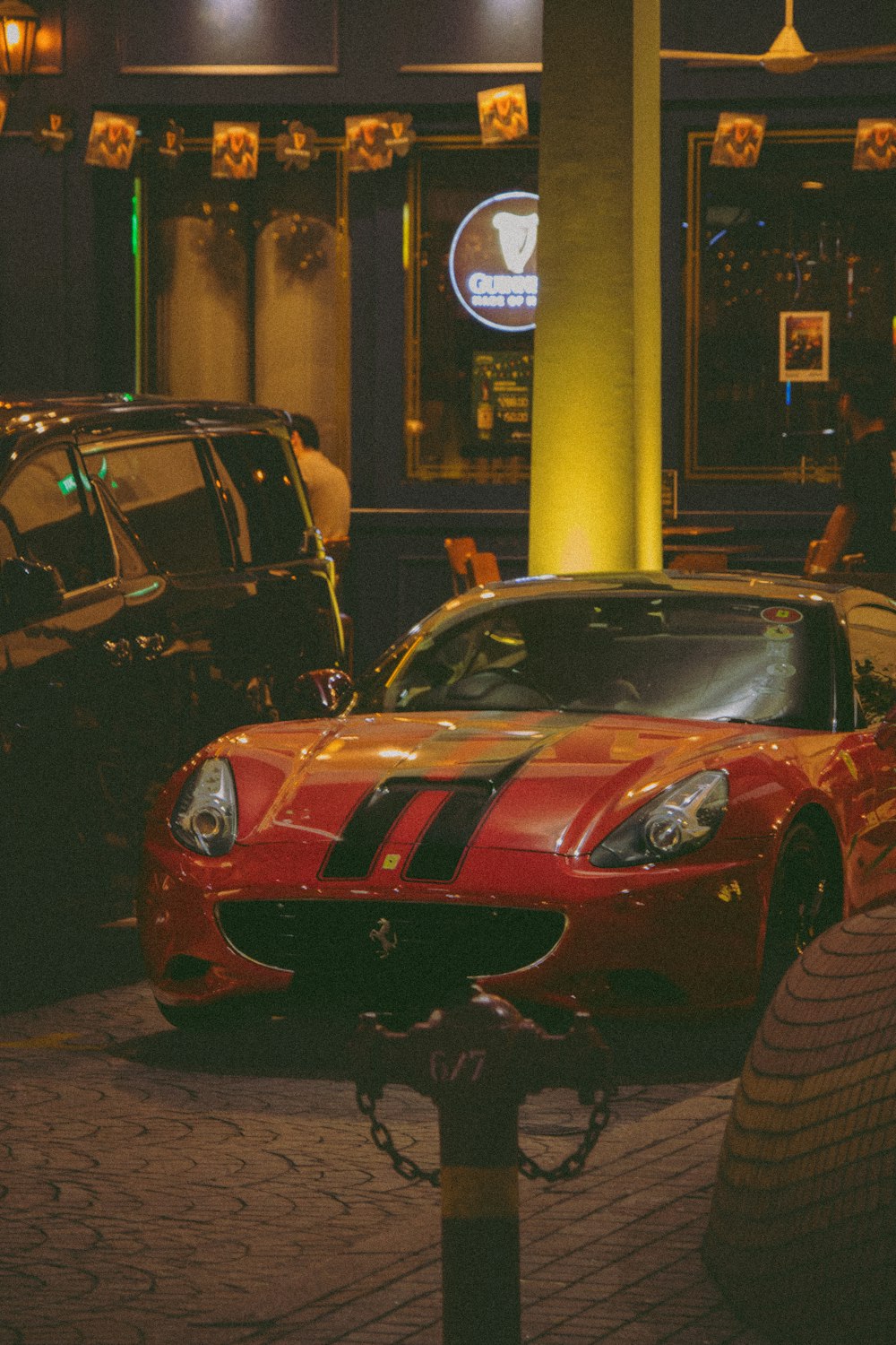 a red sports car parked in front of a building