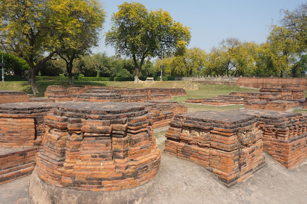 a large group of brick structures in a park