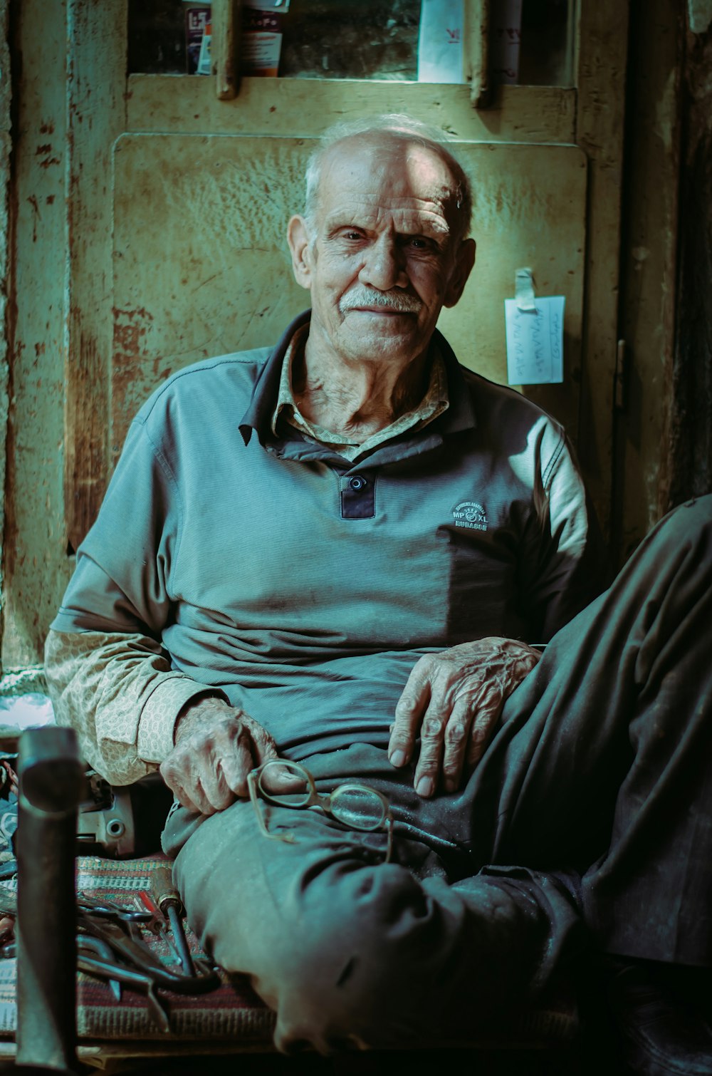 a man sitting on a chair in a room