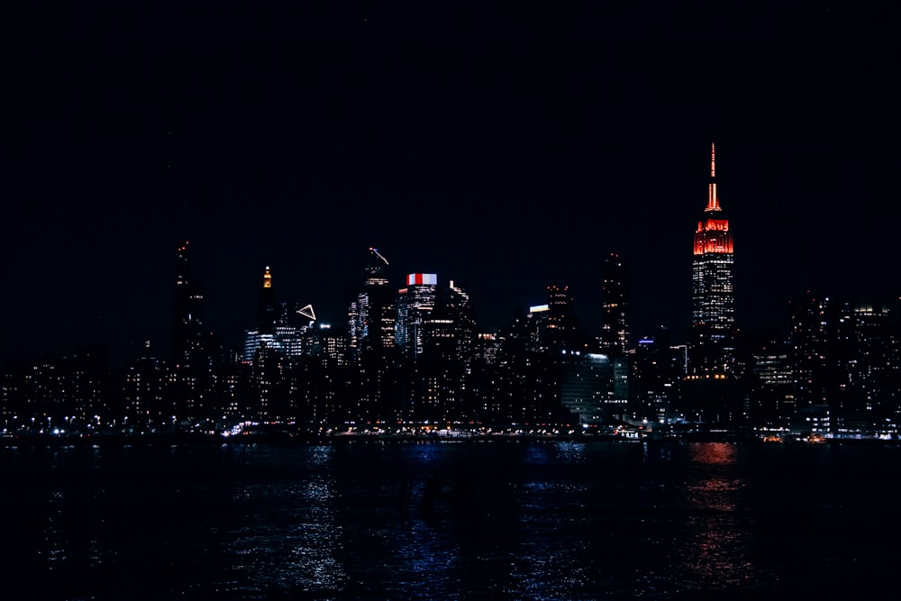 a view of a city at night from the water