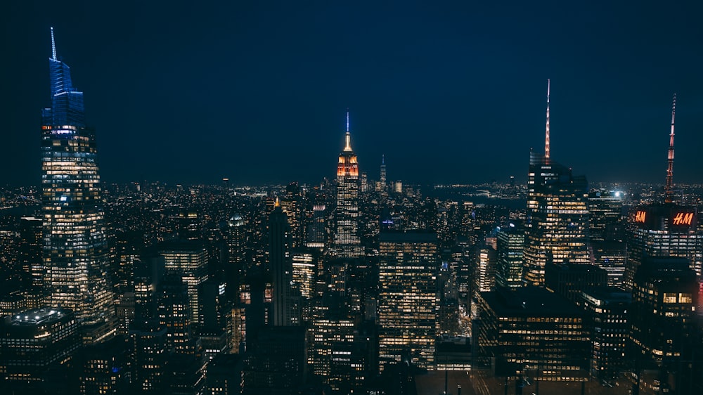 a view of a city at night from the top of a building