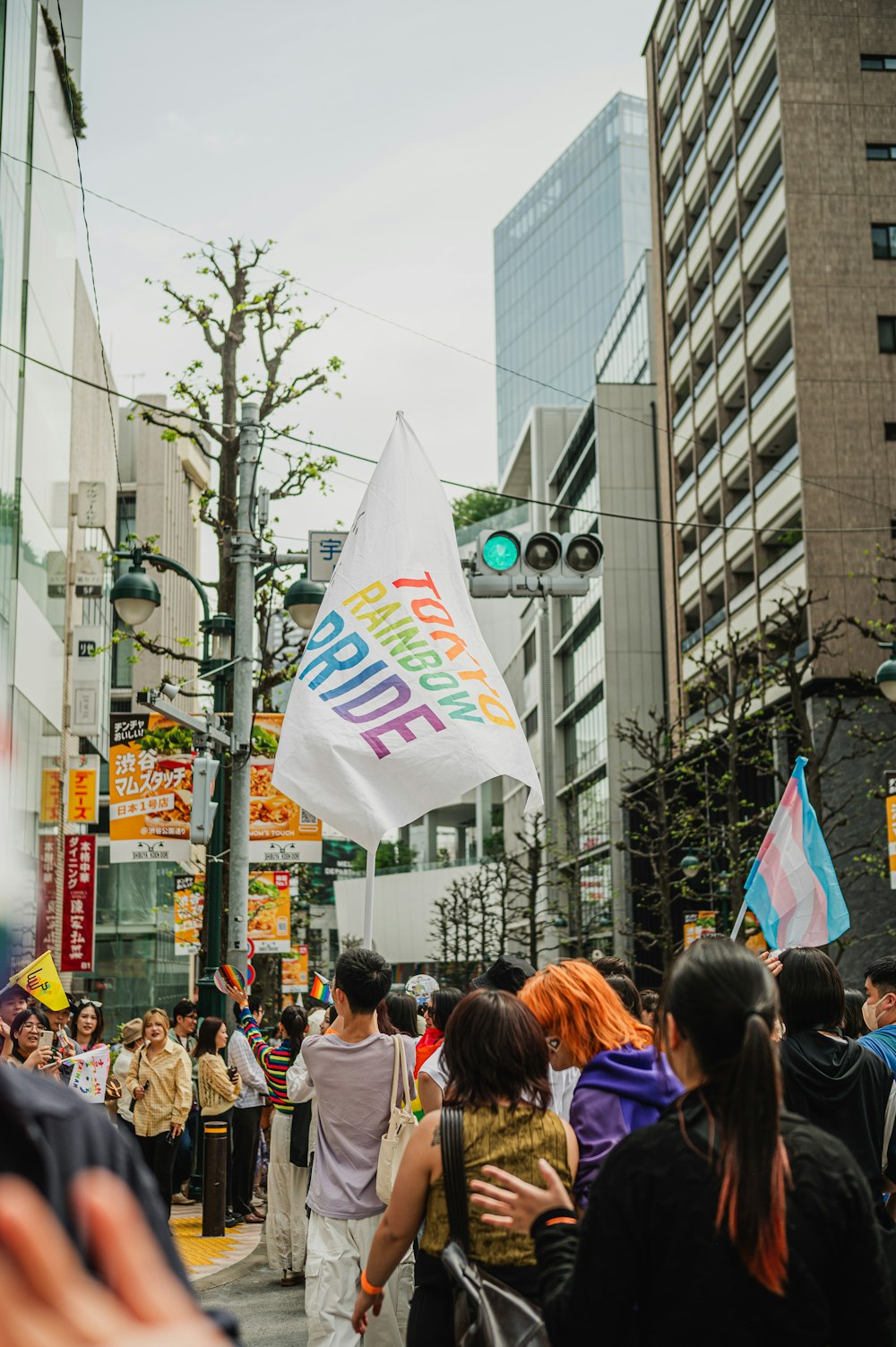 a group of people walking down a street