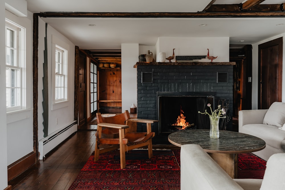 a living room filled with furniture and a fire place