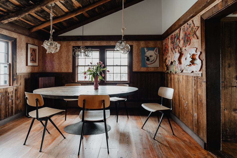 a dining room with a table and chairs