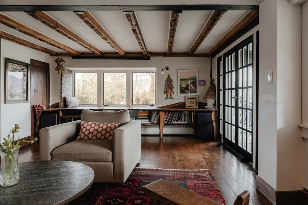 a living room filled with furniture and a wooden floor