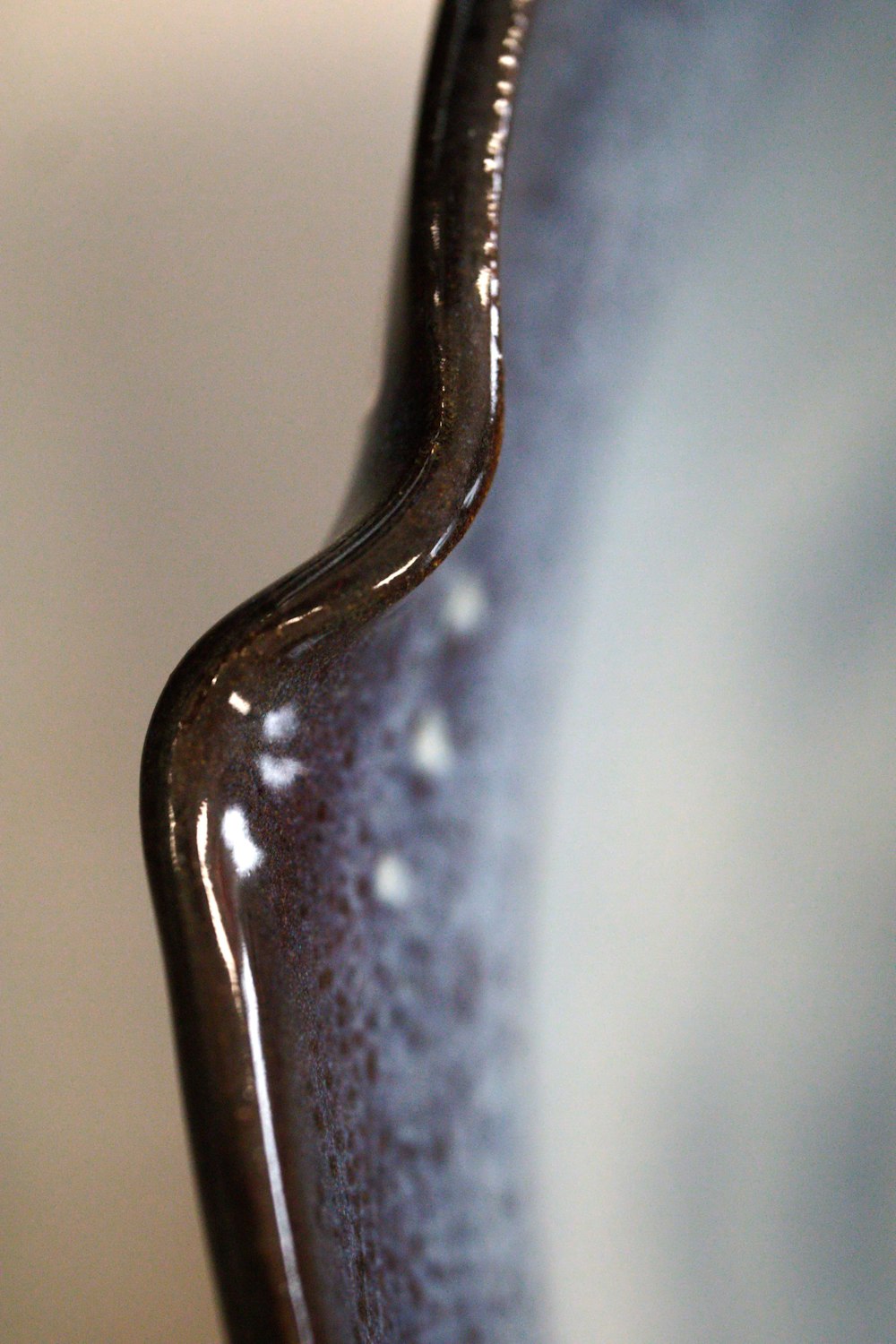 a close up view of a brown vase