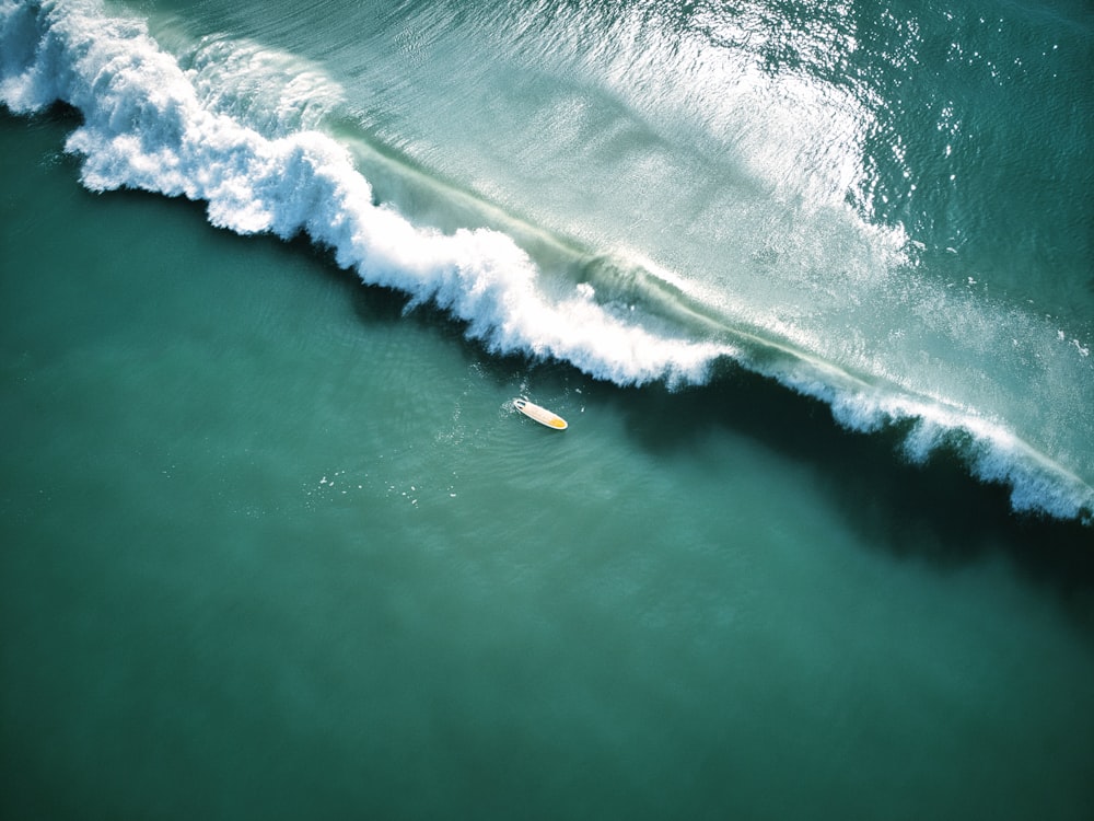 a surfer riding a wave in the ocean