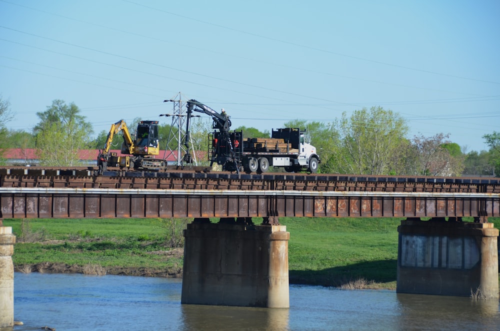 a train crossing a bridge over a river