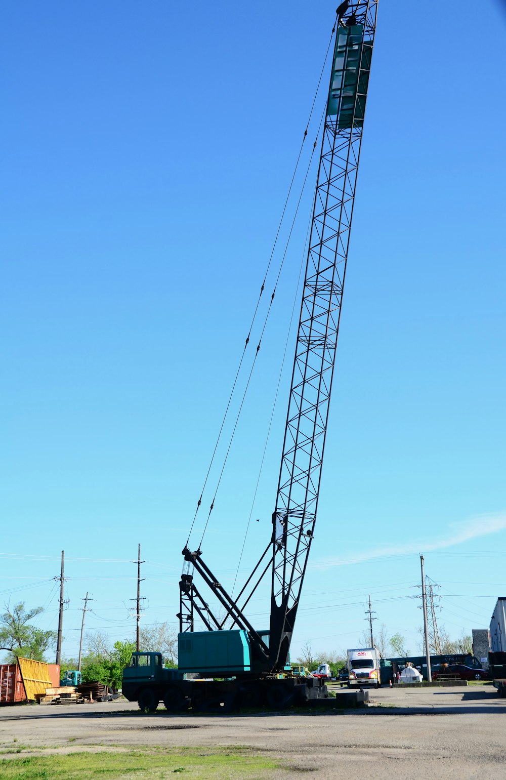 a large crane sitting on top of a parking lot