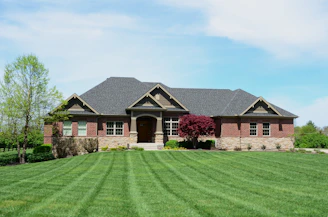 a house with a large lawn in front of it