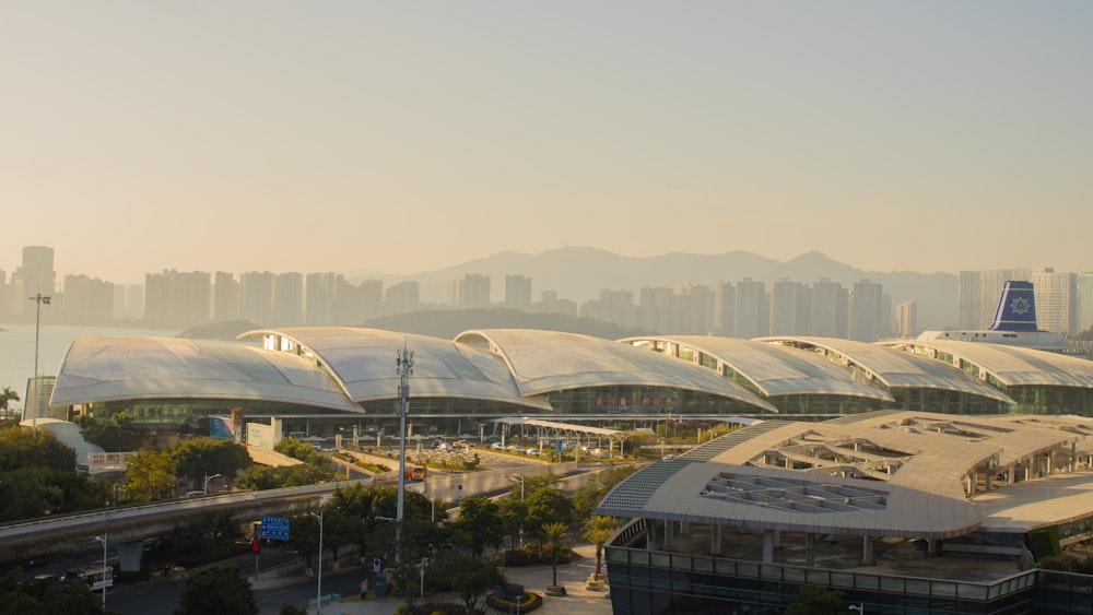 a view of an airport with a lot of buildings in the background