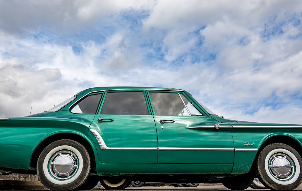 a green car parked in a parking lot